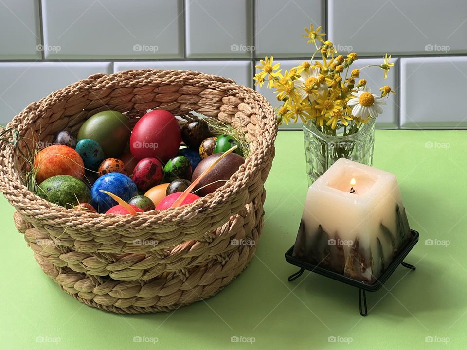 Colourful eggs and candle 
