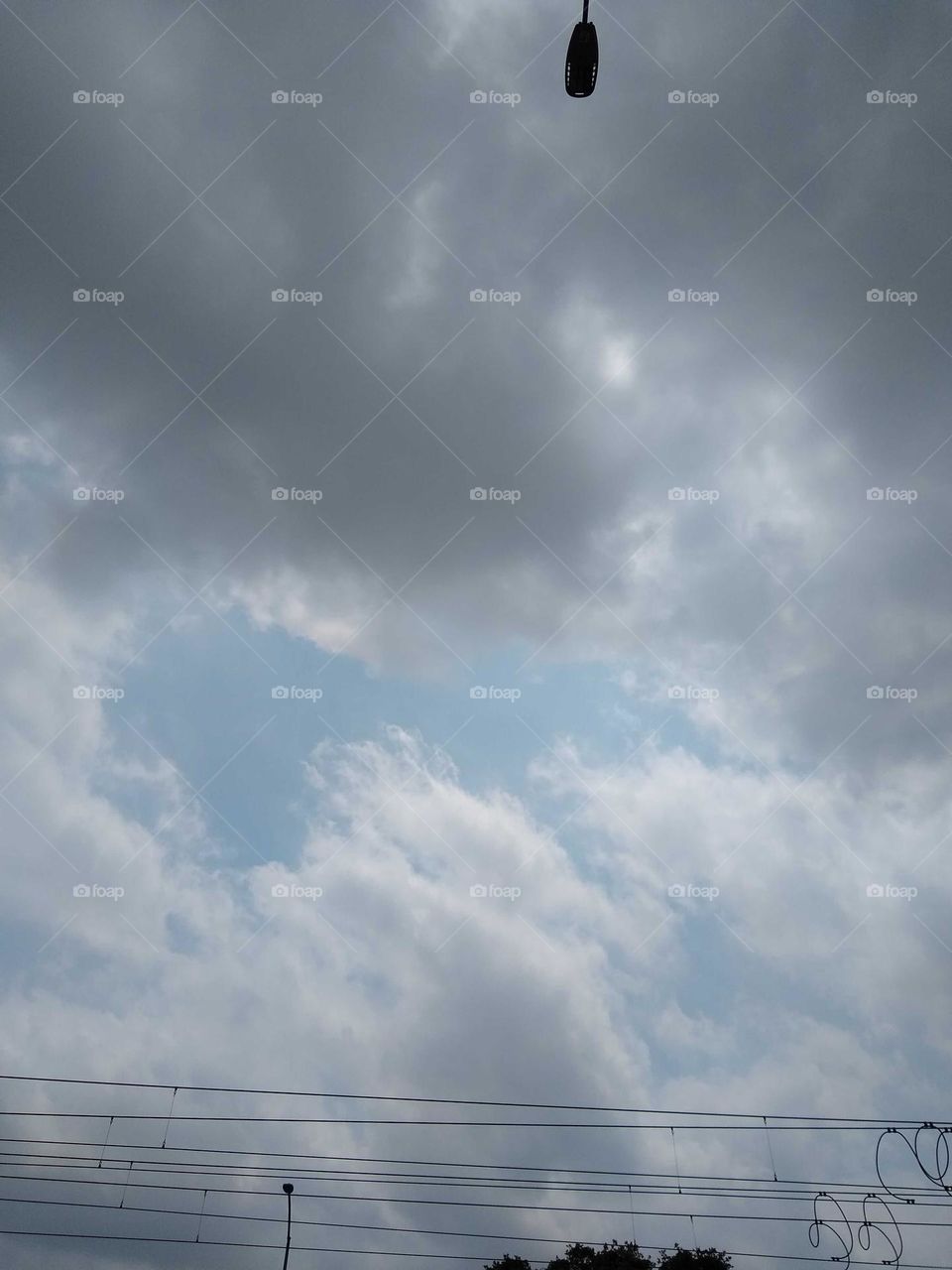 I thought this was a wondrous shot of the clouds and the sky peeking through in between.
