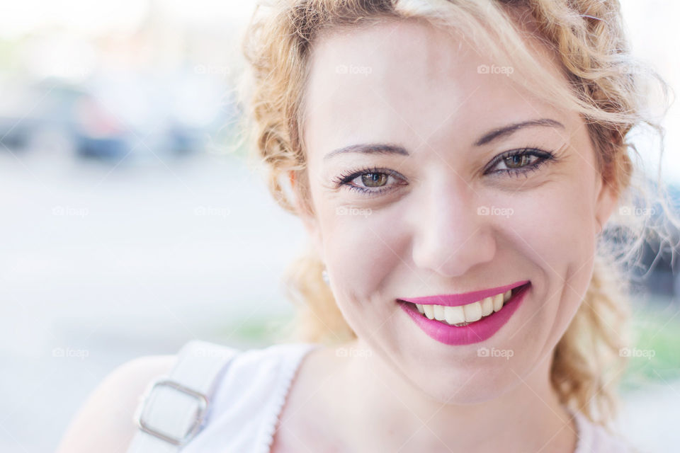 girl smiling. pretty blond girl smiling closeup