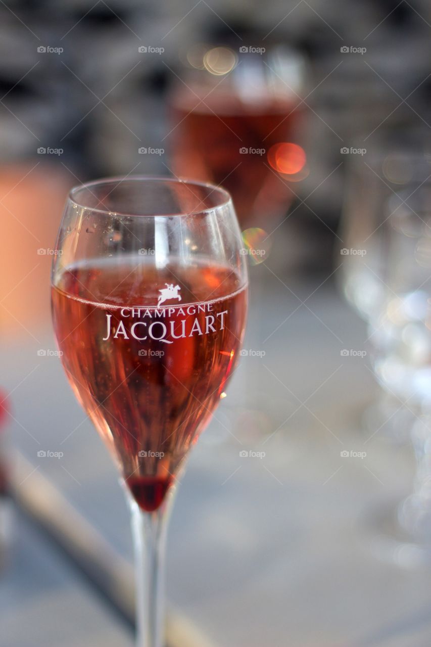 A small glass of pink champagne