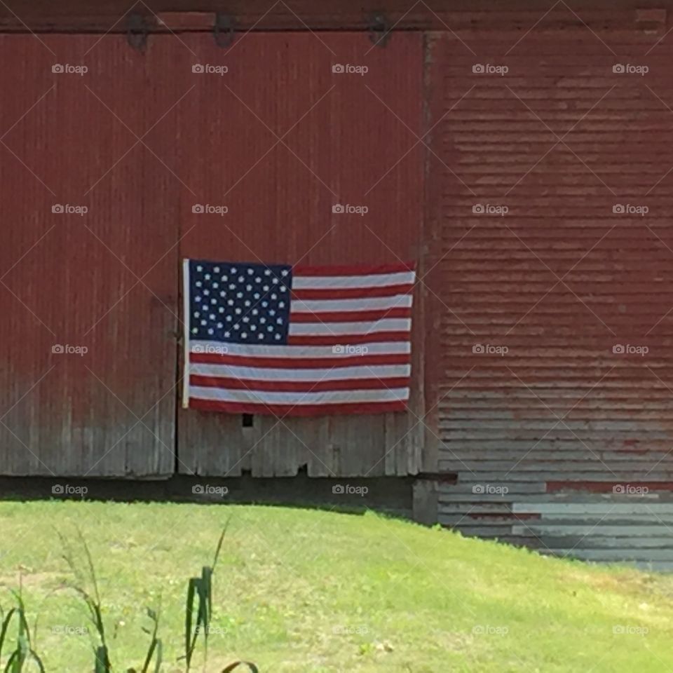 American flag on old barn 
