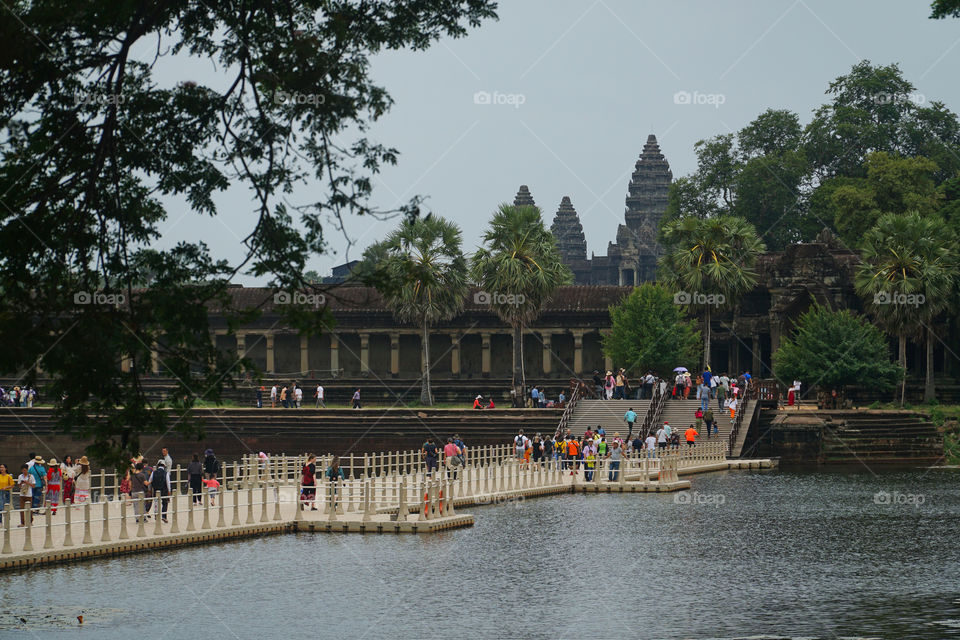 Tourists entering Angkor Wat temple Cambodia