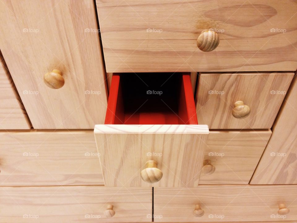 High angle view of wooden red drawer inside