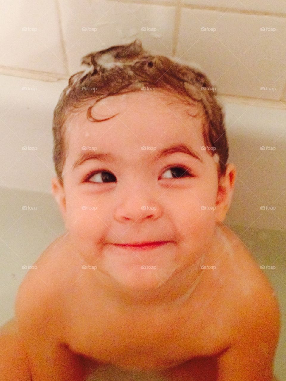 Girl with cute soapy hair and facial expression that melts your heart 
