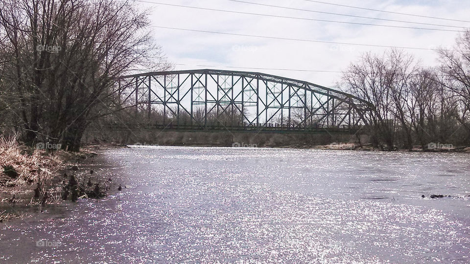 bridge over glittering water
