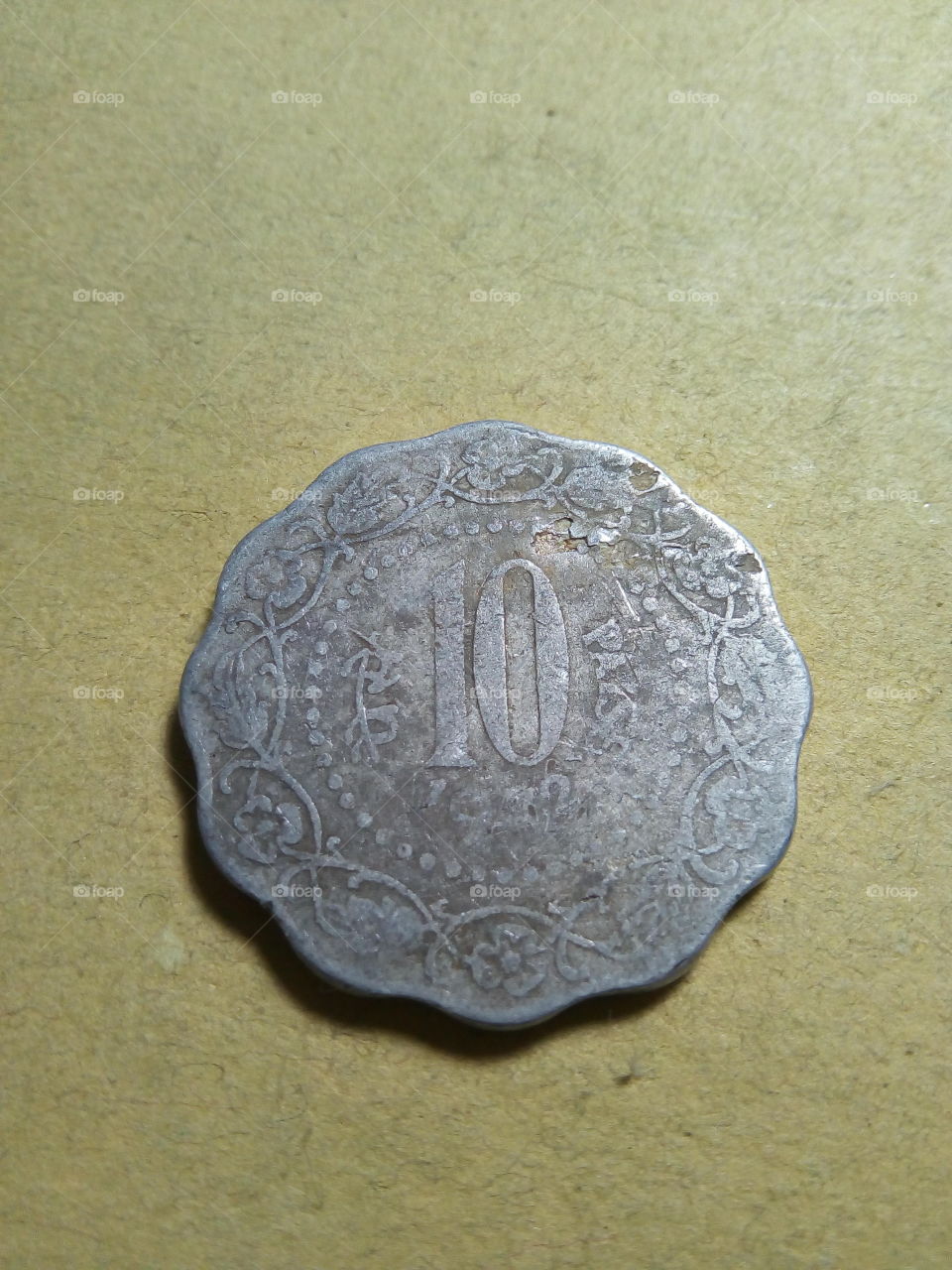 A coin of ten paise- 1/10 share of Indian Rupee issued by Government of India in 1972.