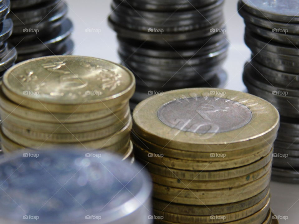 Indian Currency in Rupees - Coins are stacked with definite arrangement.