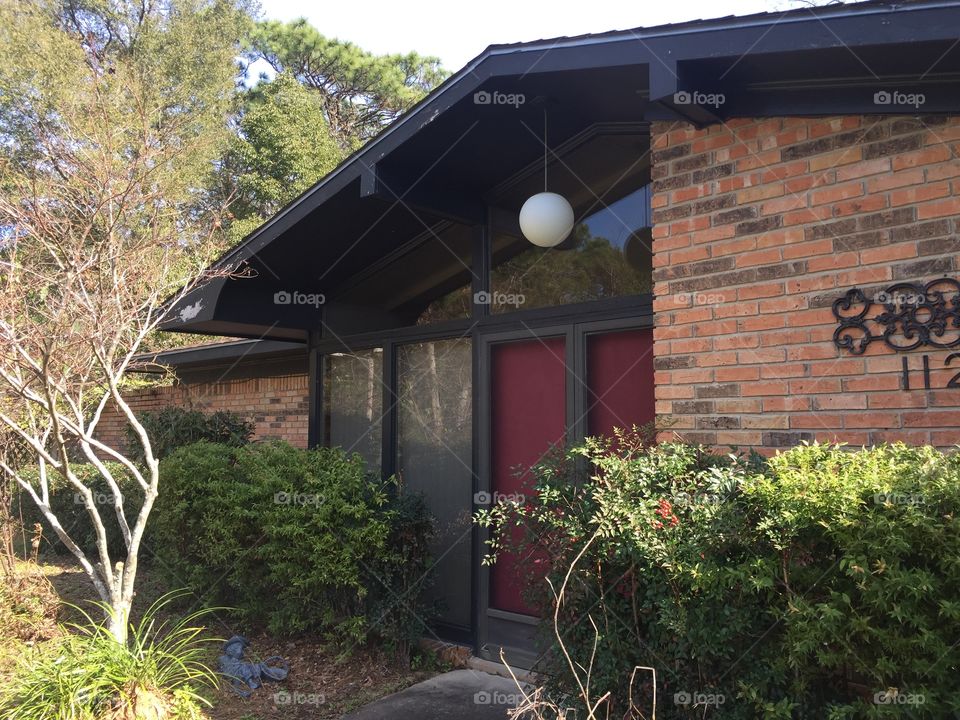 Retro red brick house with a white light