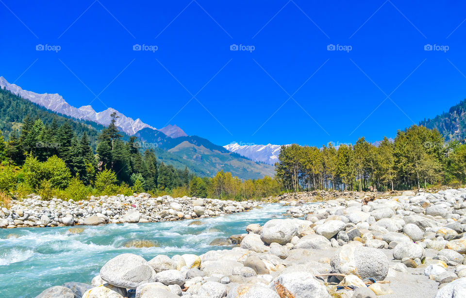 Mountain valley during bright sunny day. Beautiful natural landscape in the summer time.Mountain valley during sunny day. Natural summer landscape. Travel nature background poster concept