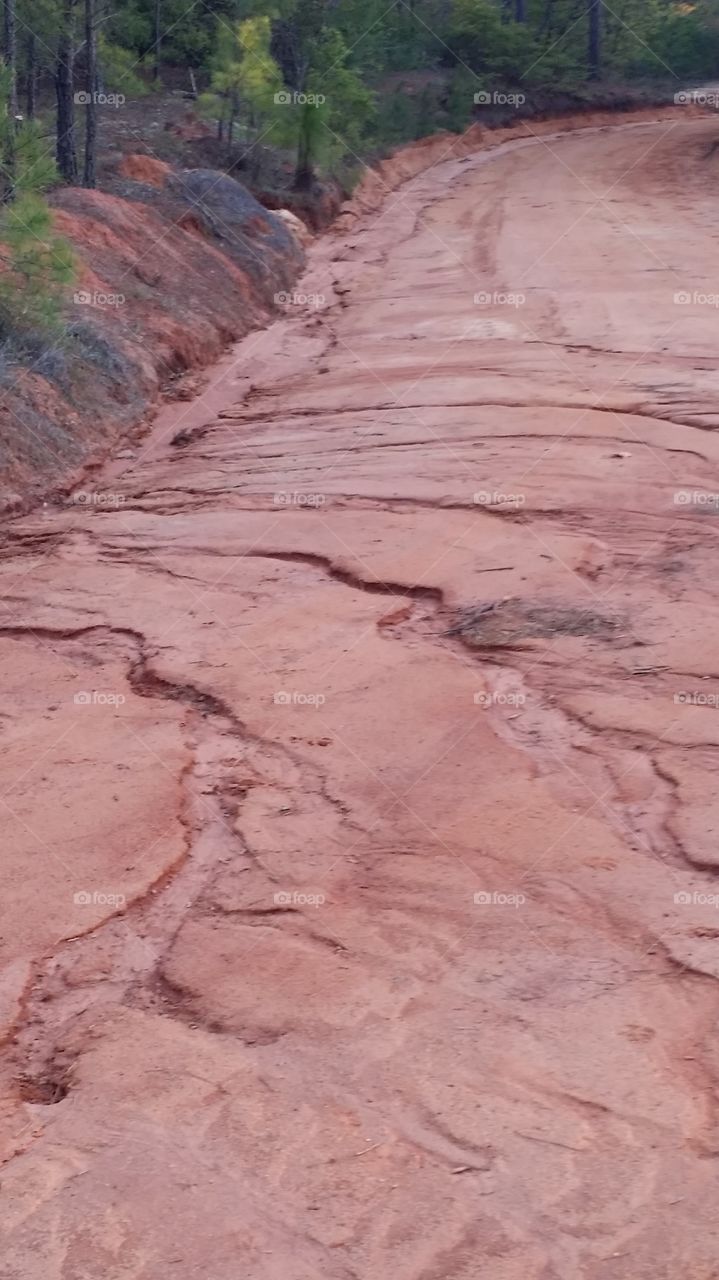 Eroded road. this is what my very long driveway looks like when it rains heavily 