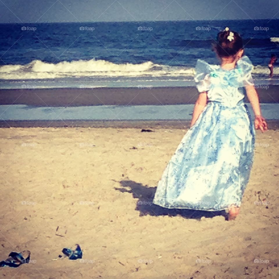 Enjoying the moment . Kicking off her shoes to dance in the sand and be whatever and wherever her imagination was taking her 