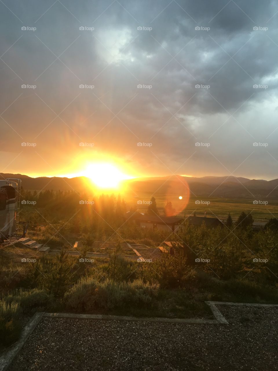 Sunset at s mountain campground after rain.