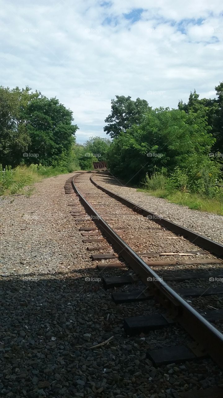 Railroad tracks on a sunny afternoon. 