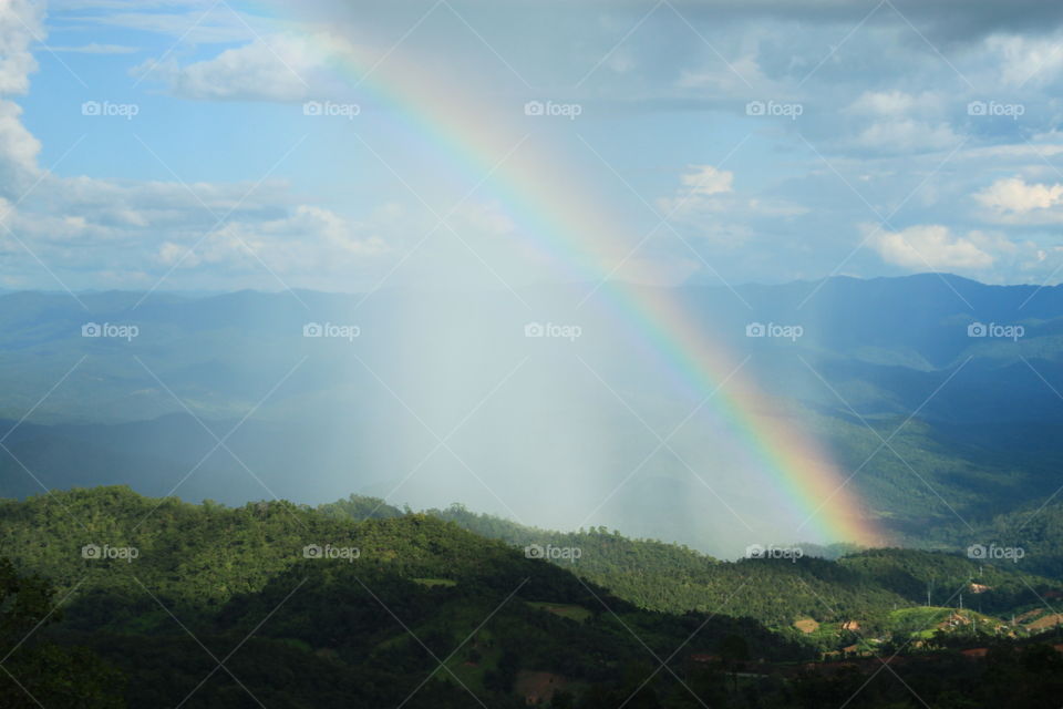 After the rain. Rainbow in nature.