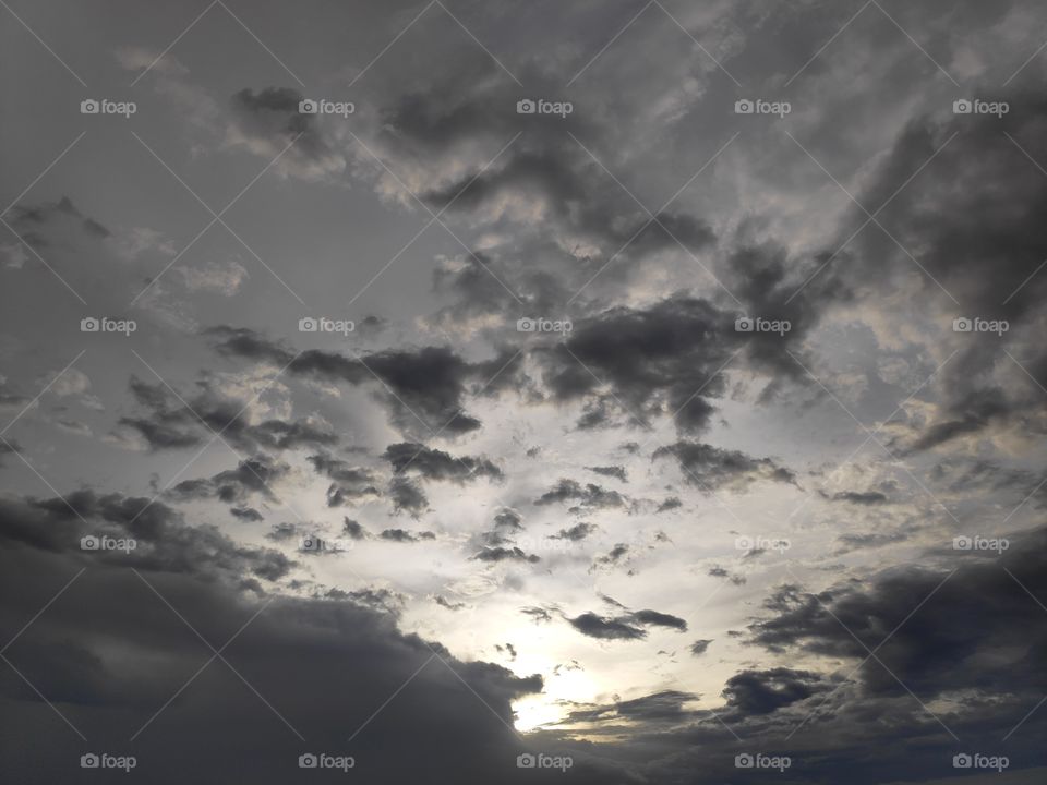 a image of sun set with cloudy sky