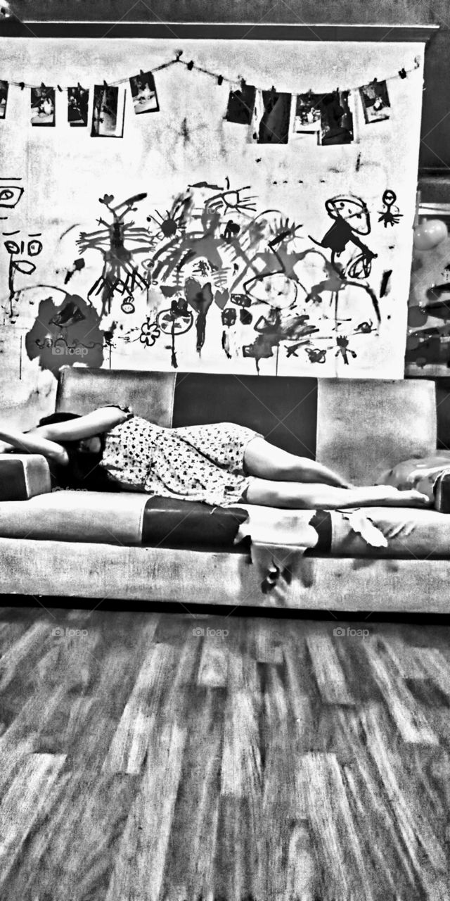 The lonely home with the lonely soul laying on the ragged sofa