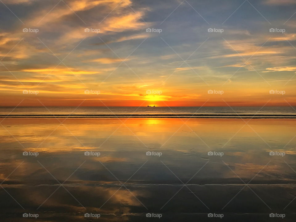 Sunset reflected on beach