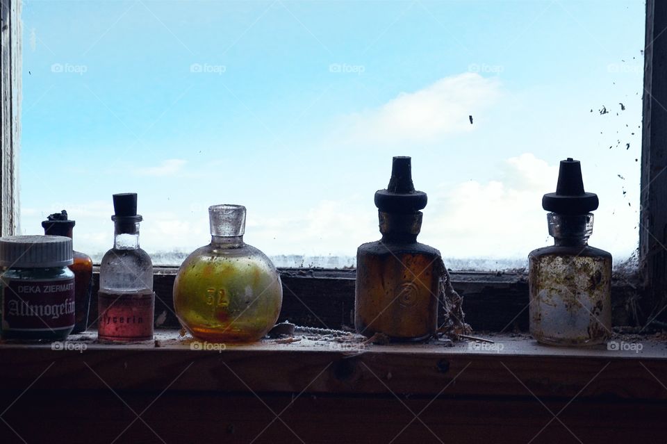 Small old bottles in a window