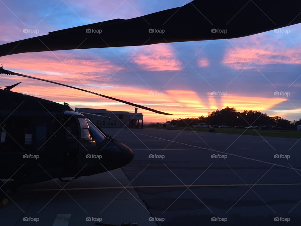 Sunset over the blades of a Blackhawk 
