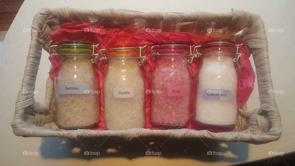 homemade scented bath salts and small glass milk container