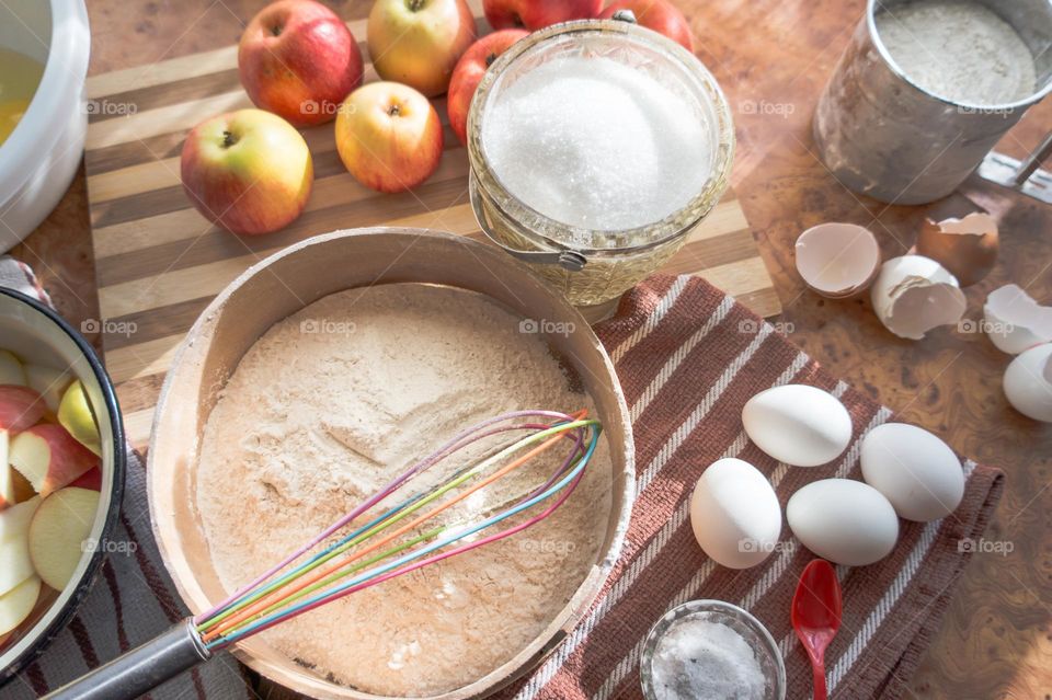 Making homemade puffed apple pie with eggs, sugar and flour.