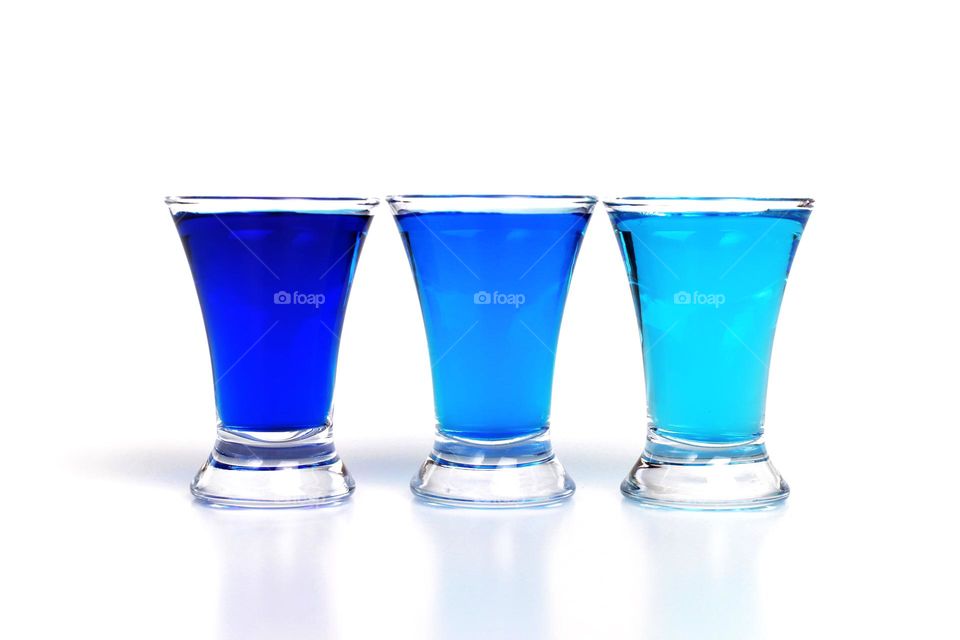 three blue liquid shots