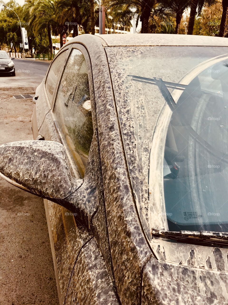 A car covered in sand 