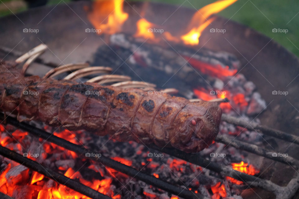 Venison grilled on open fire pit
