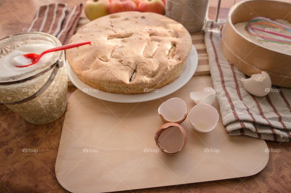 Making homemade puffed apple pie with eggs, sugar and flour.