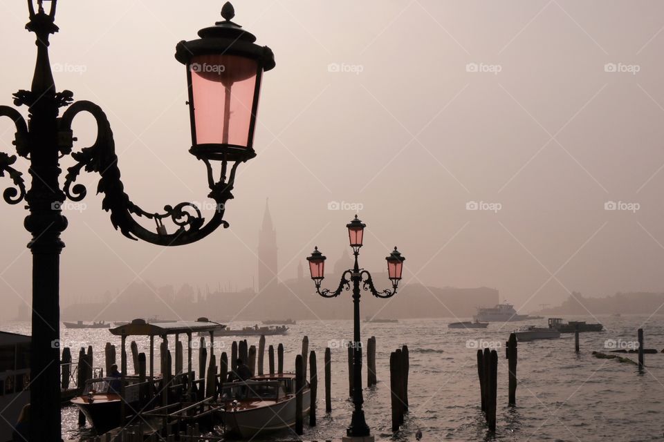 Lanterns on the background of venice in the fog