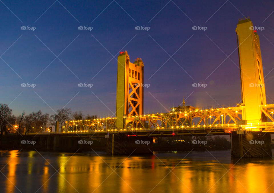 Illuminated bridge at night