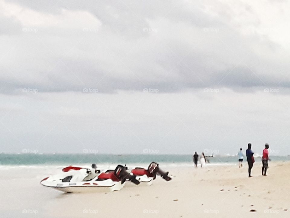 speedboats by the ocean and tourists in the Dominican Republic