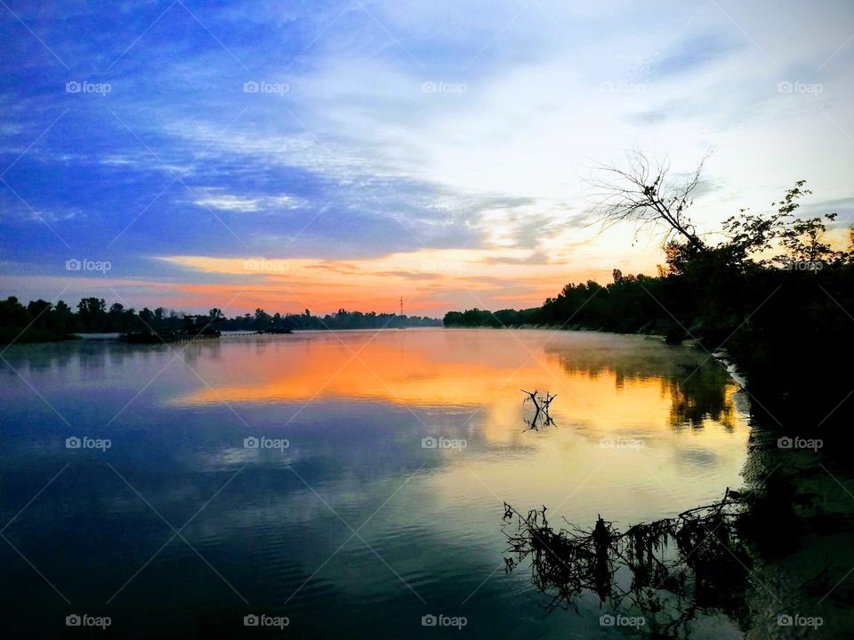Sunset under a river