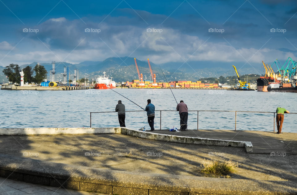 Black Sea and fish mens in Batumi 