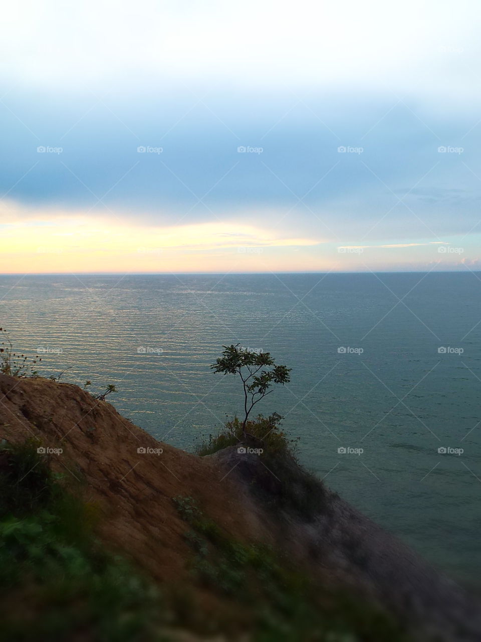 Sand dune cliff overlooking Lake Michigan at dusk