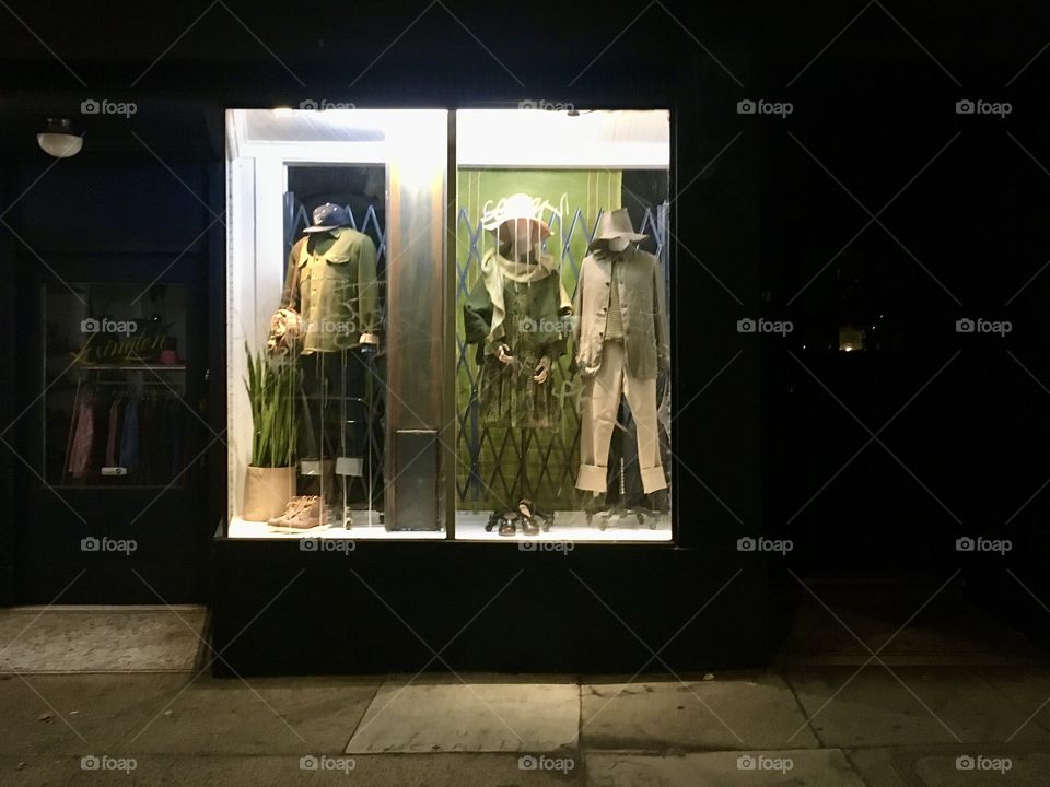 Mannequins in showcase at night