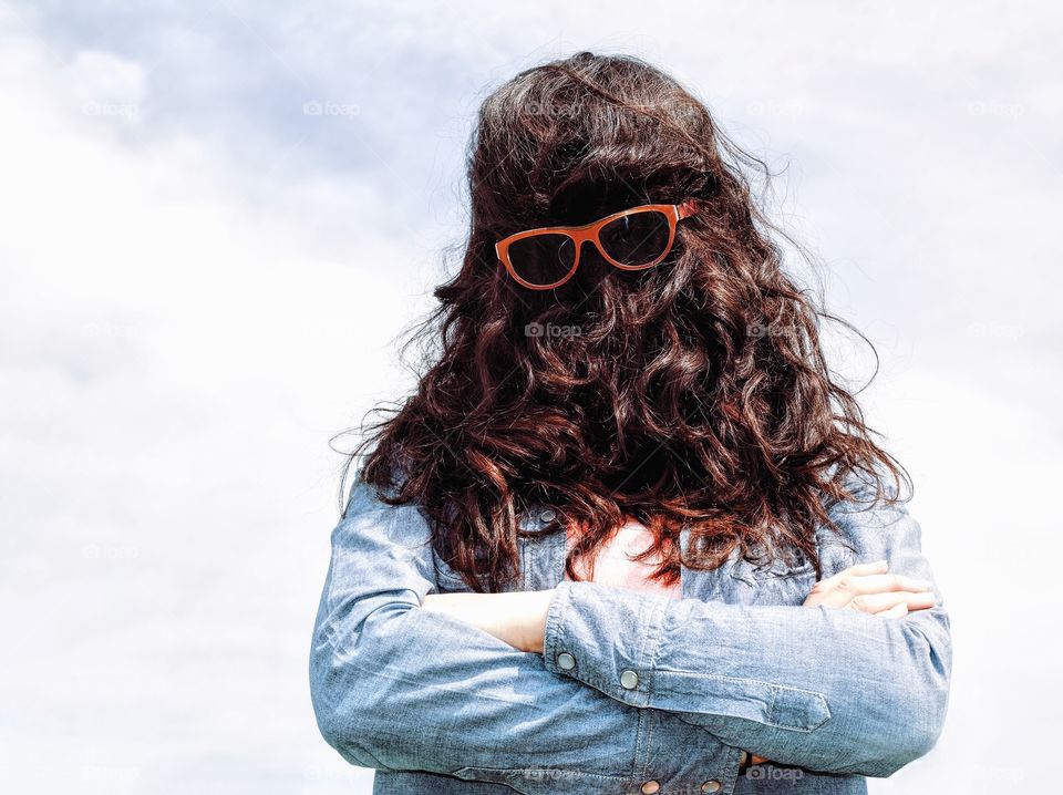 Women covering her face with hair