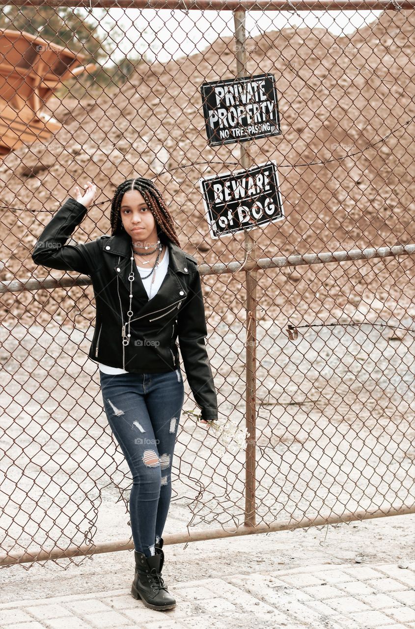 Female model in front of construction site