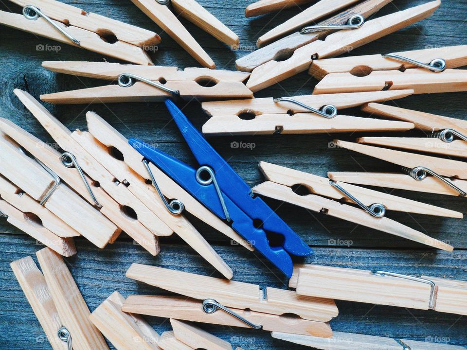 Wooden clothespins on a wooden base