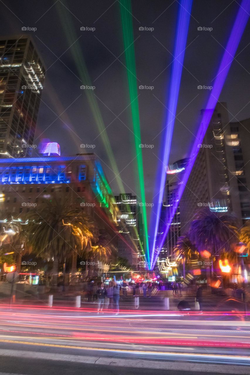 2023 San Francisco Pride light installation beaming the colors of the pride flag down market street from the ferry building on a beautiful evening