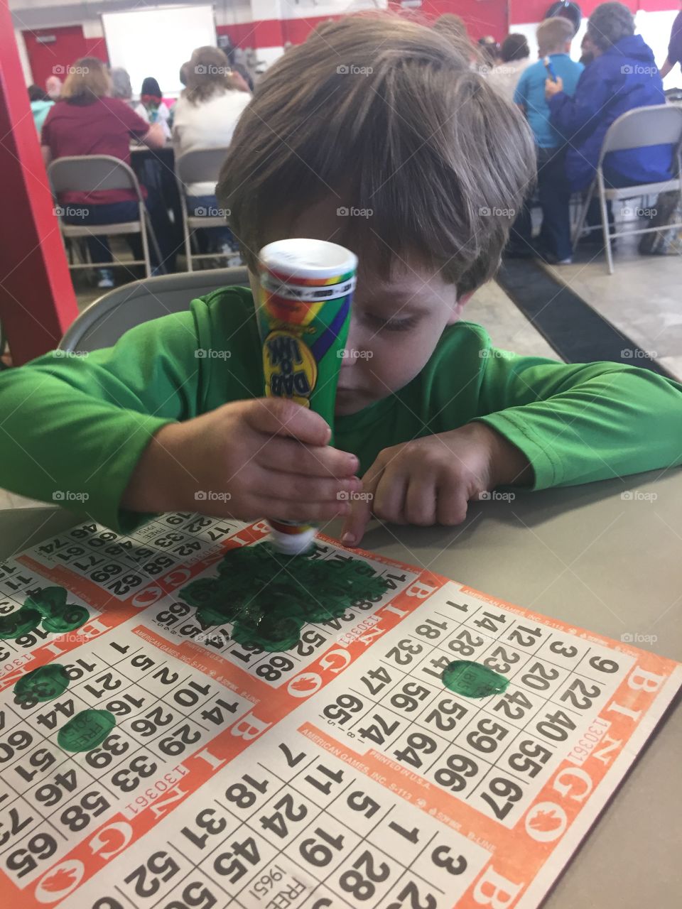 Close-up of a boy coloring paper