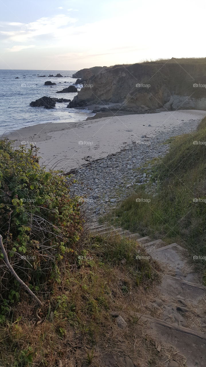 Tide coming in and breaking up on the coast of Pescadero. Just after dawn. A hidden path to the water.