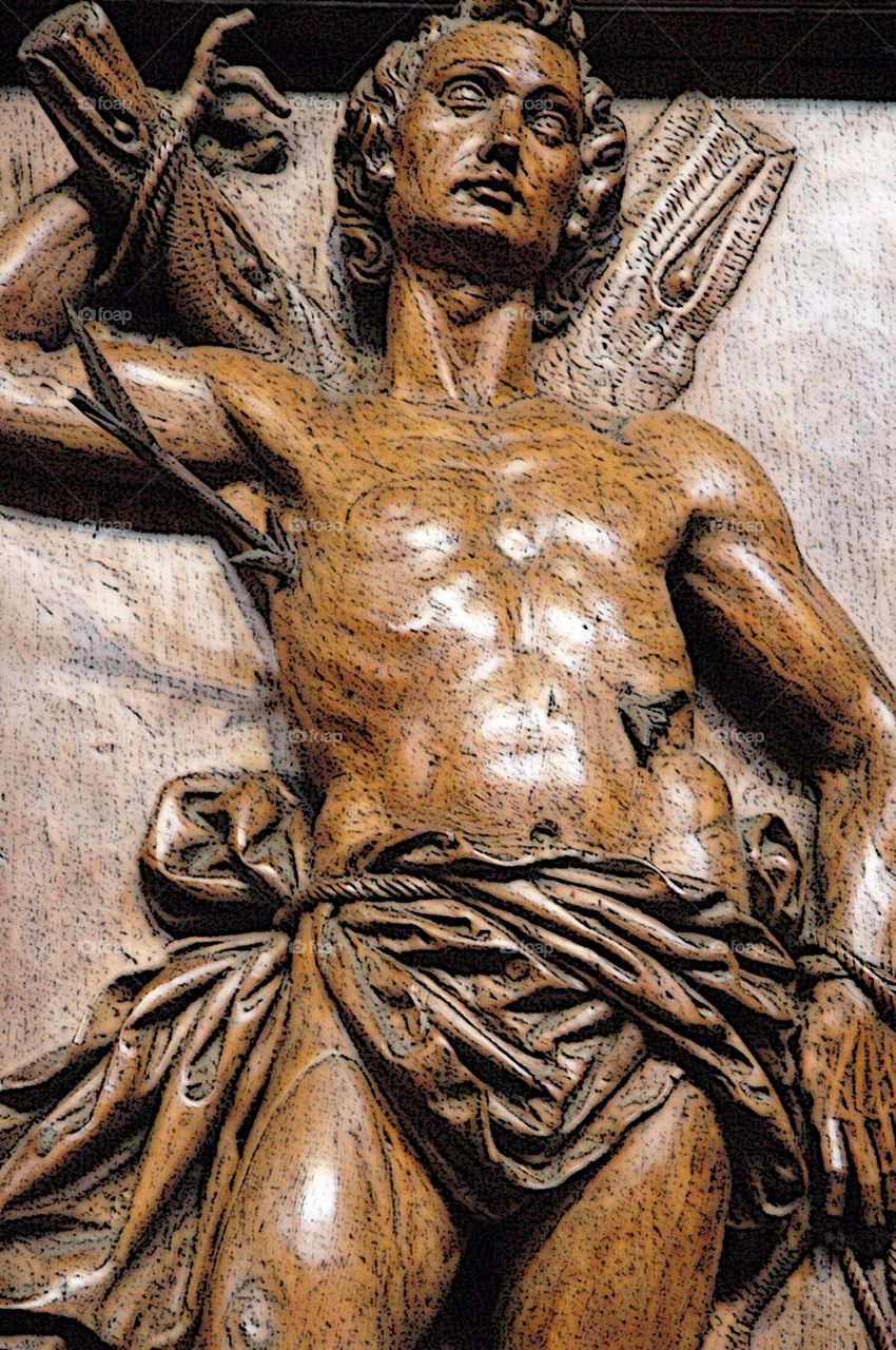 Wood carving of saint