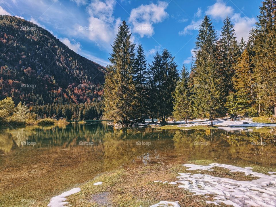 Scenic view at the green italian lake at mountains.