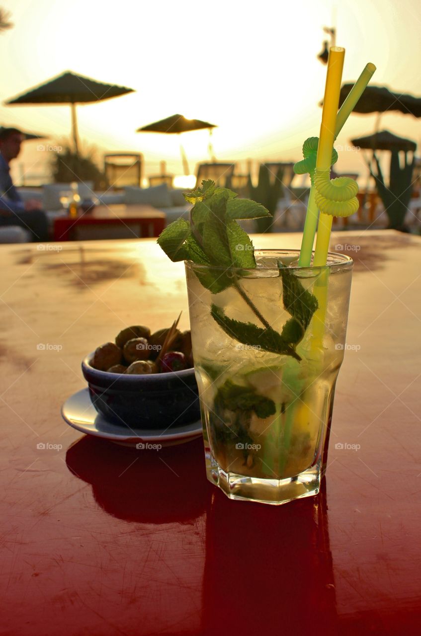 Mojito time. A Mojito at sunset at a beach bar in Essaouira, Morocco