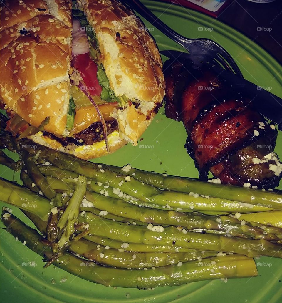 hamburger and bacon wrapped stuffed jalapeno and asparagus garlic fries.