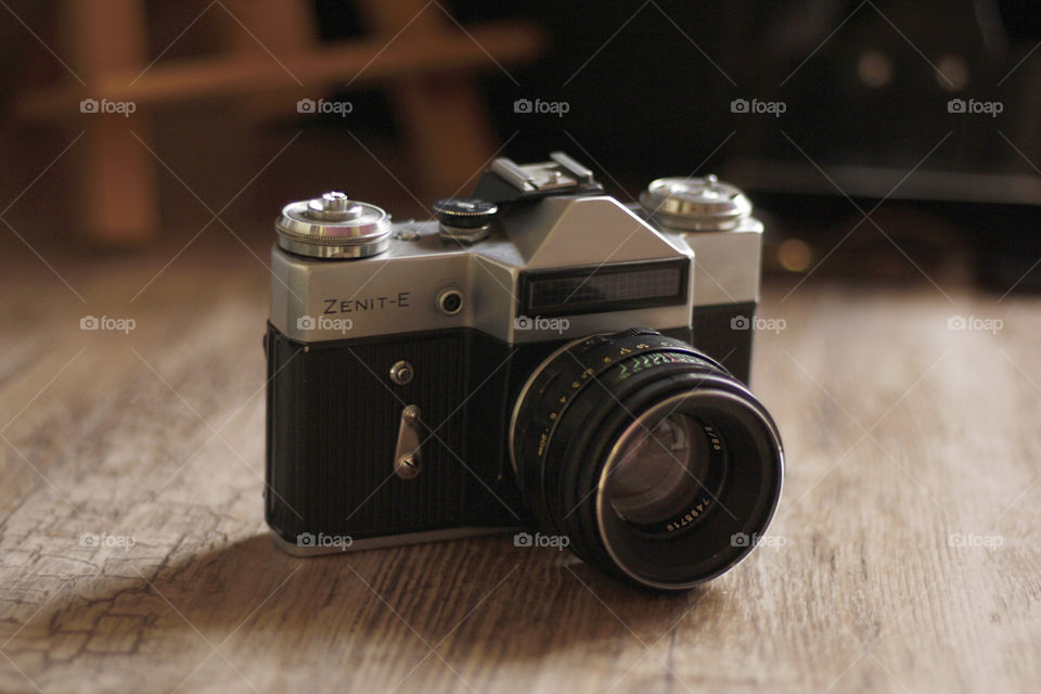 Vintage camera on a wooden background 2