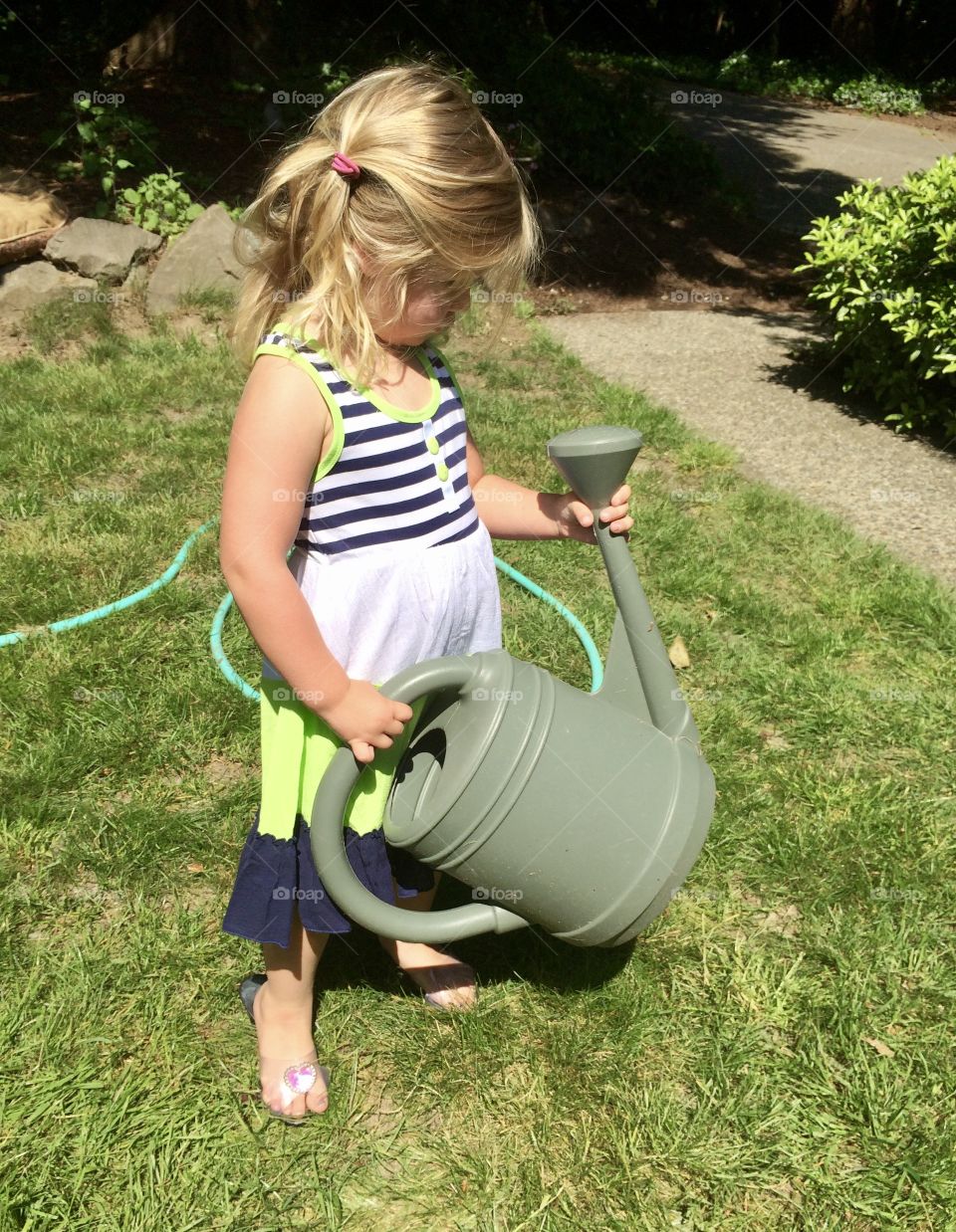 Little girl and watering can 