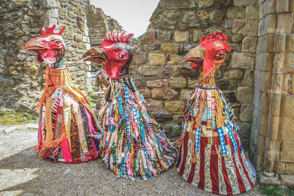 3 cockerel effigies colourfully decorated for a spring festival 