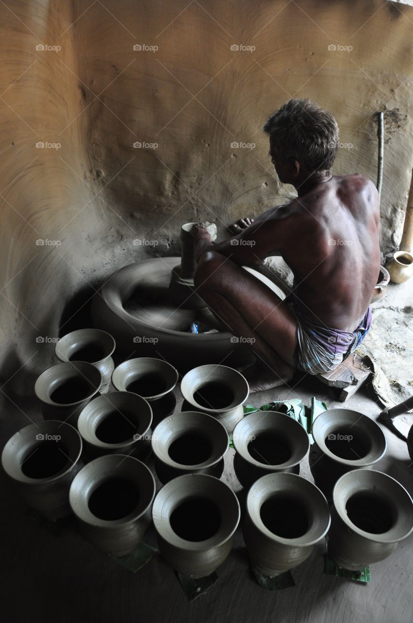 Village men work hard to earn his family's livelihood.Clicked from a Bangladeshi village named Nathuapara.